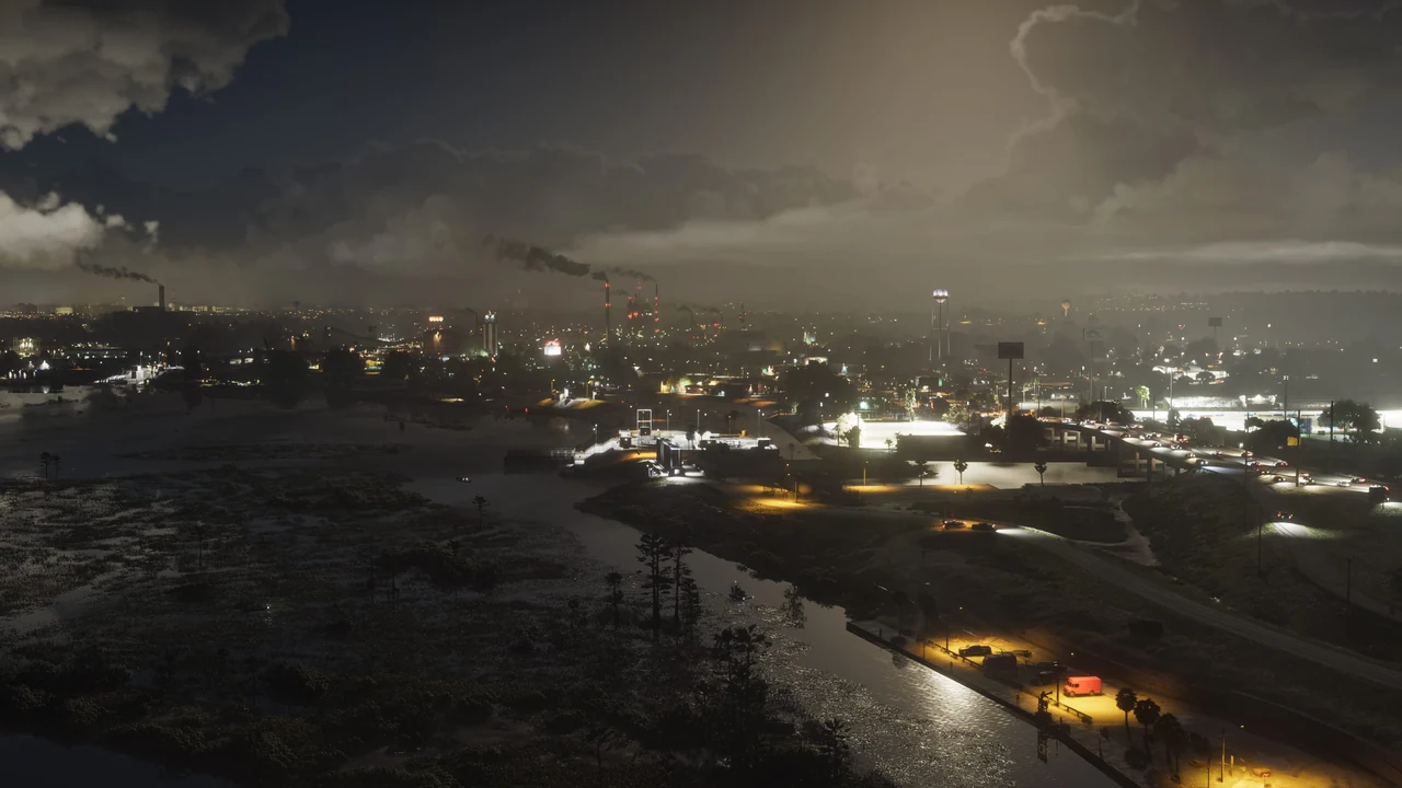 Captura oficial de GTA VI: vista nocturna de Ambrosia con chimeneas al fondo